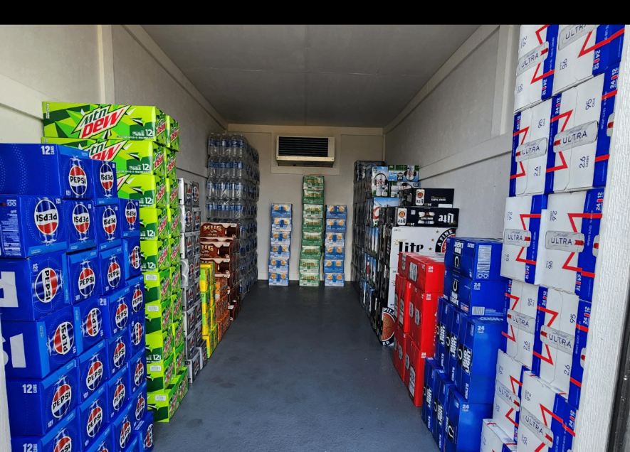 Inside the 6D's LLC refrigerated trailer stocked with cases of beer and soda